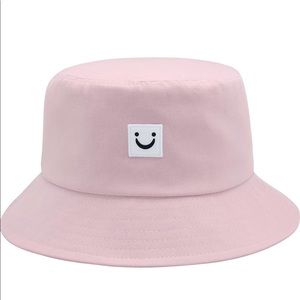 Light pink smile bucket hat outdoor